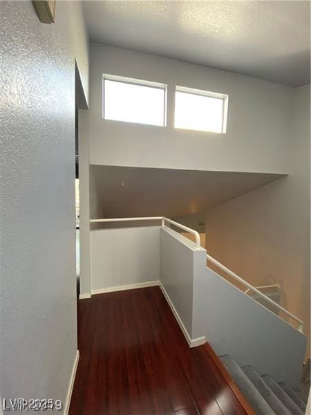 interior space with hardwood / wood-style floors and a textured ceiling