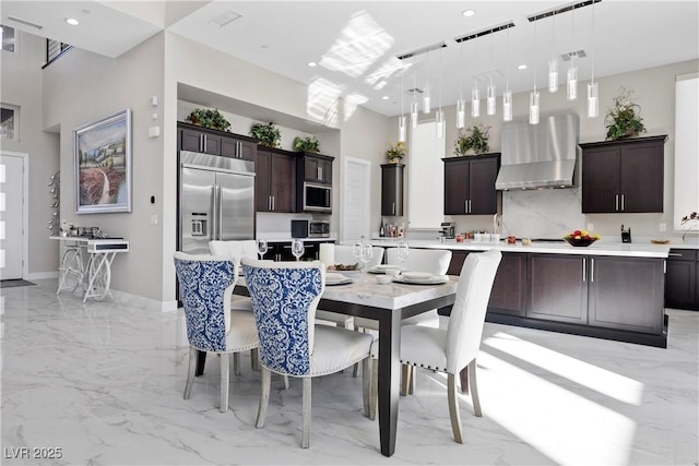 dining space with a high ceiling