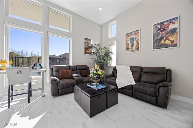 living room featuring a high ceiling