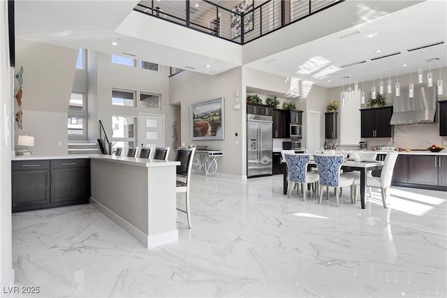 dining area with a high ceiling