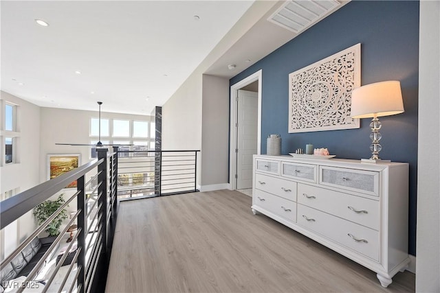 corridor featuring light hardwood / wood-style floors