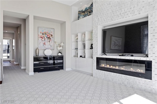 carpeted living room featuring built in features