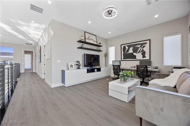 living room with light hardwood / wood-style flooring