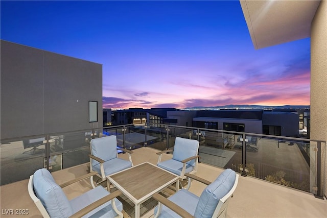 view of balcony at dusk