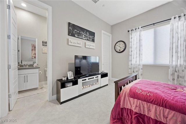 carpeted bedroom with ensuite bathroom