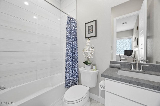 full bathroom with vanity, shower / bath combo, and toilet