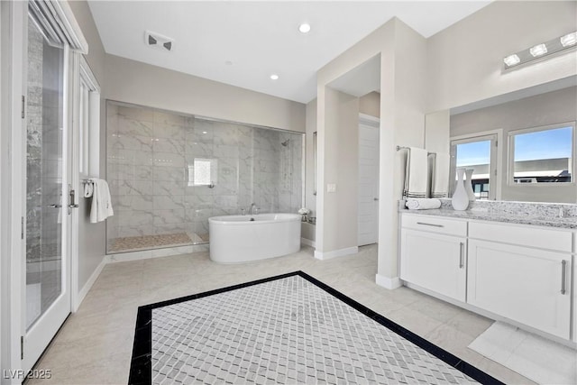 bathroom with shower with separate bathtub and vanity