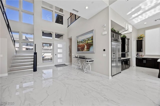 foyer featuring a high ceiling