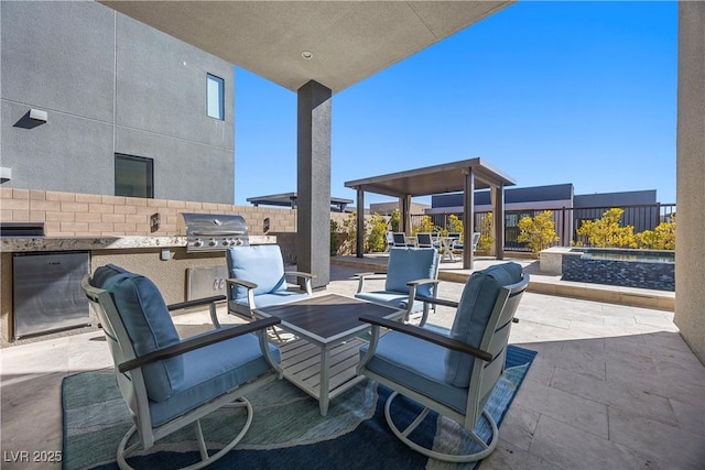 view of patio featuring an outdoor kitchen and grilling area