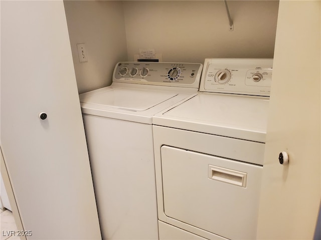 laundry room with washing machine and clothes dryer