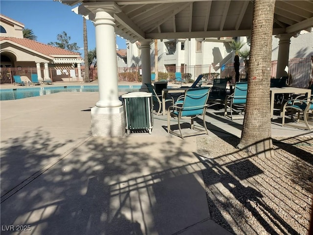 view of patio with a gazebo and a community pool