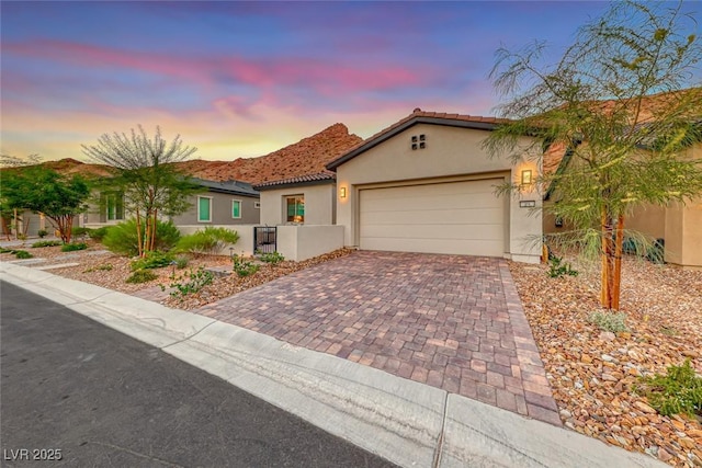 mediterranean / spanish-style home featuring a garage