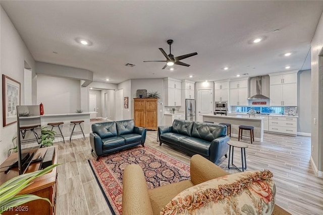 living room featuring ceiling fan