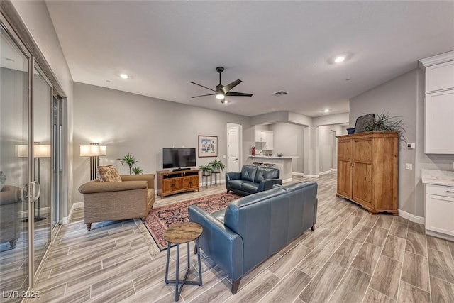 living room with ceiling fan