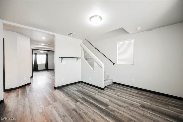 unfurnished living room with hardwood / wood-style floors