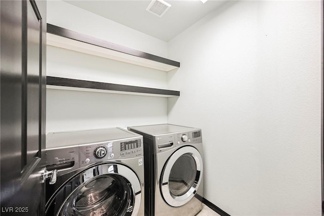 laundry room featuring washer and dryer