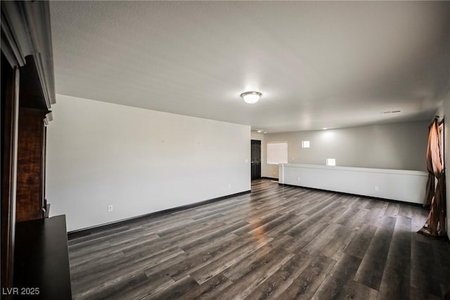 spare room featuring dark hardwood / wood-style floors