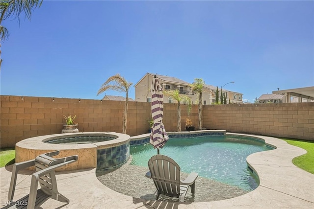 view of swimming pool with an in ground hot tub and a patio area