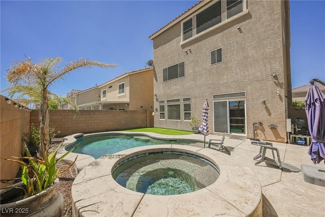 view of swimming pool with an in ground hot tub and a patio area