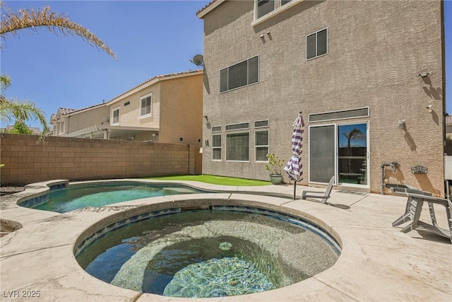 view of swimming pool featuring an in ground hot tub and a patio area