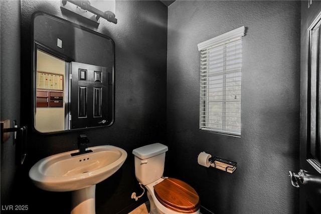 bathroom with sink and toilet