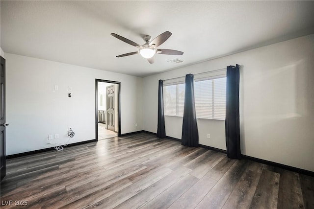 empty room featuring hardwood / wood-style floors and ceiling fan