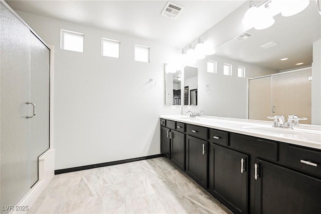 bathroom with vanity and an enclosed shower