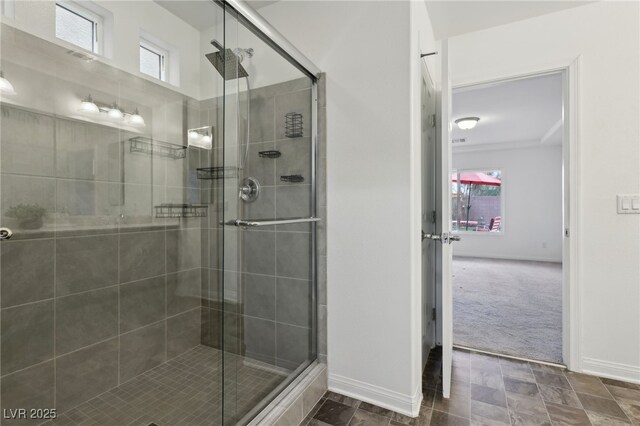 bathroom with a shower with door