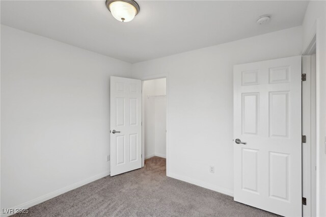 unfurnished bedroom featuring light colored carpet