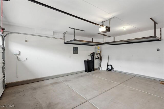 garage featuring a garage door opener and electric panel