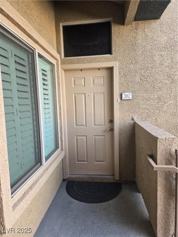 8985 S Durango Dr Unit 2062, Las Vegas, NV 89113 - entrance to property with stucco siding