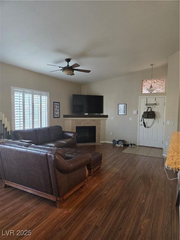 8985 S Durango Dr Unit 2062, Las Vegas, NV 89113 - living area featuring a tiled fireplace, dark wood-style floors, lofted ceiling, and ceiling fan