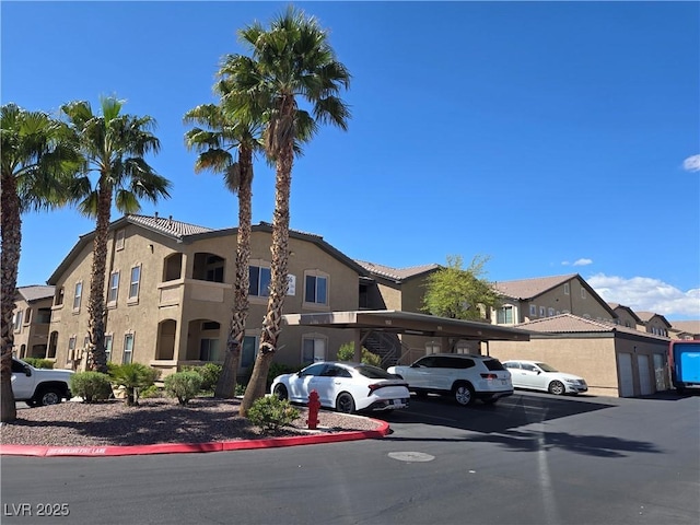 8985 S Durango Dr Unit 2062, Las Vegas, NV 89113 - view of property featuring a residential view and covered and uncovered parking