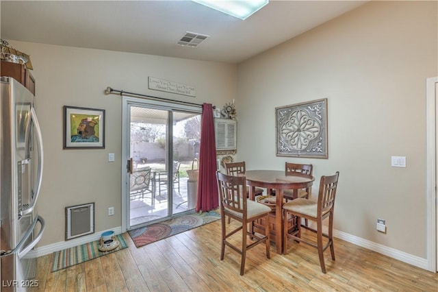 dining space with light wood-type flooring