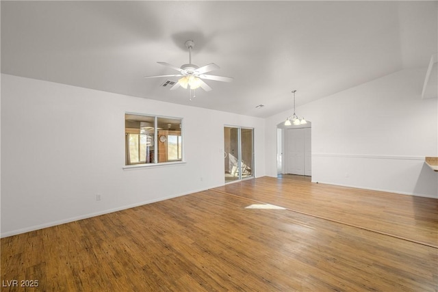 unfurnished living room featuring lofted ceiling, hardwood / wood-style floors, and ceiling fan