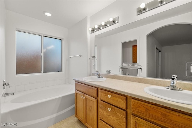 bathroom with vanity and a bathtub