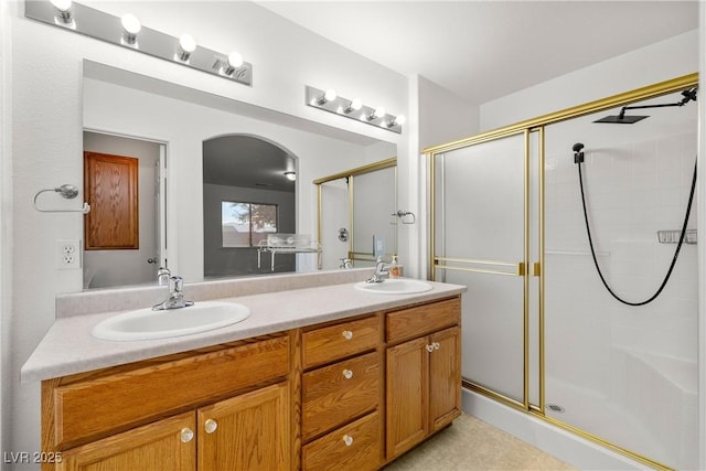 bathroom featuring vanity and walk in shower