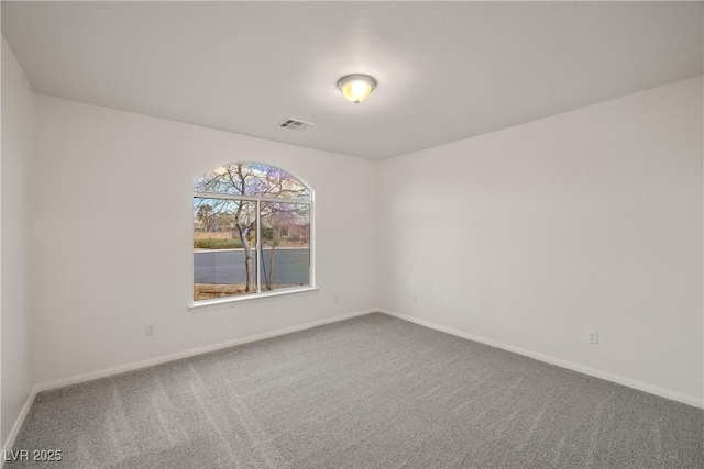 unfurnished room featuring carpet floors