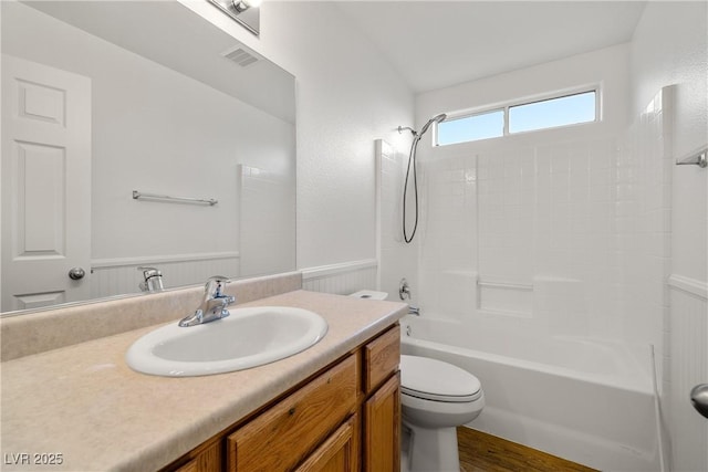 full bathroom with shower / bath combination, vanity, and toilet