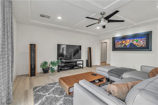 living room with wood-type flooring and ceiling fan