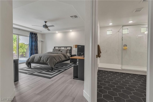 bedroom with light wood-style floors, ceiling fan, visible vents, and recessed lighting