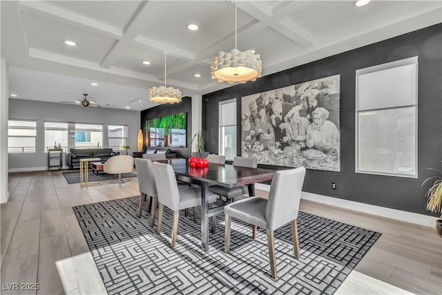 dining space with hardwood / wood-style flooring, coffered ceiling, and beamed ceiling