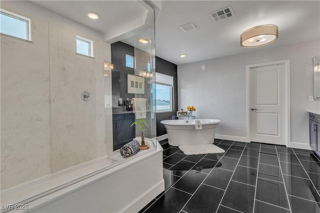 bathroom with tile patterned floors, vanity, and independent shower and bath