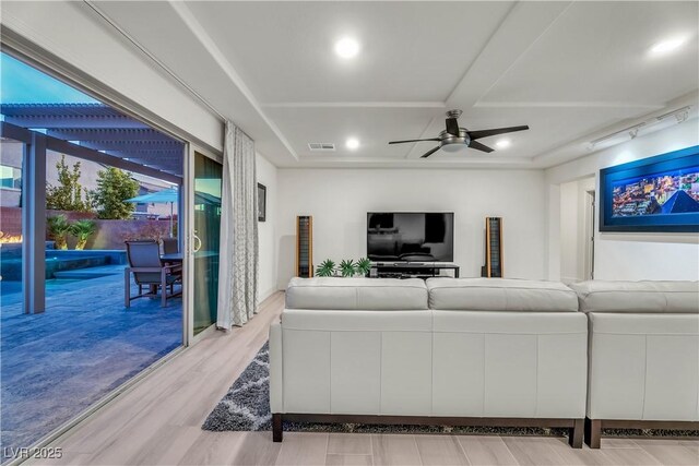 living room featuring ceiling fan and light wood-type flooring