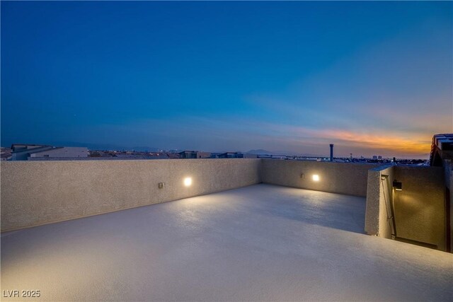 view of patio terrace at dusk