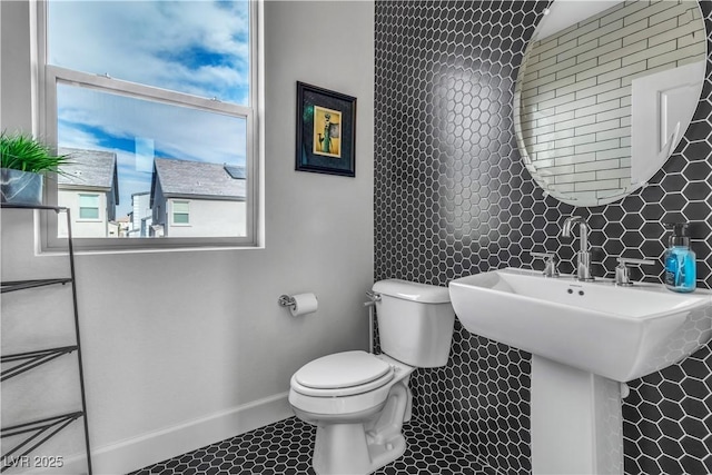 bathroom with tile patterned flooring and toilet