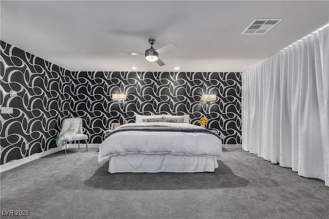 carpeted bedroom with baseboards, a ceiling fan, visible vents, and wallpapered walls