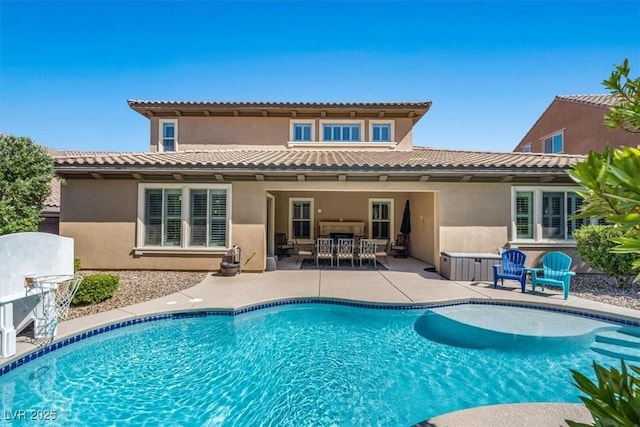 2920 Josephine Dr, Henderson, NV 89044 - rear view of house with stucco siding, a patio, an outdoor pool, and outdoor dining space