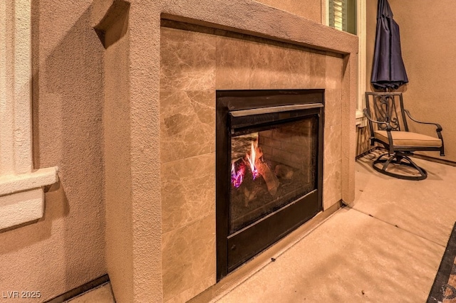 2920 Josephine Dr, Henderson, NV 89044 - detailed view of concrete floors and a warm lit fireplace