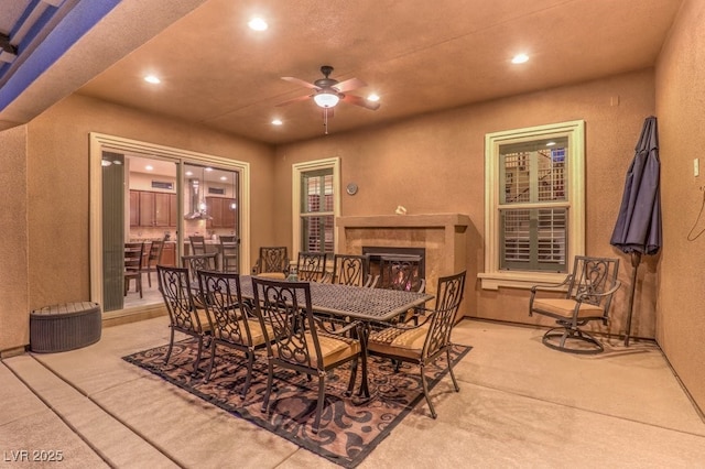 2920 Josephine Dr, Henderson, NV 89044 - dining room featuring recessed lighting, ceiling fan, a textured wall, and a tile fireplace
